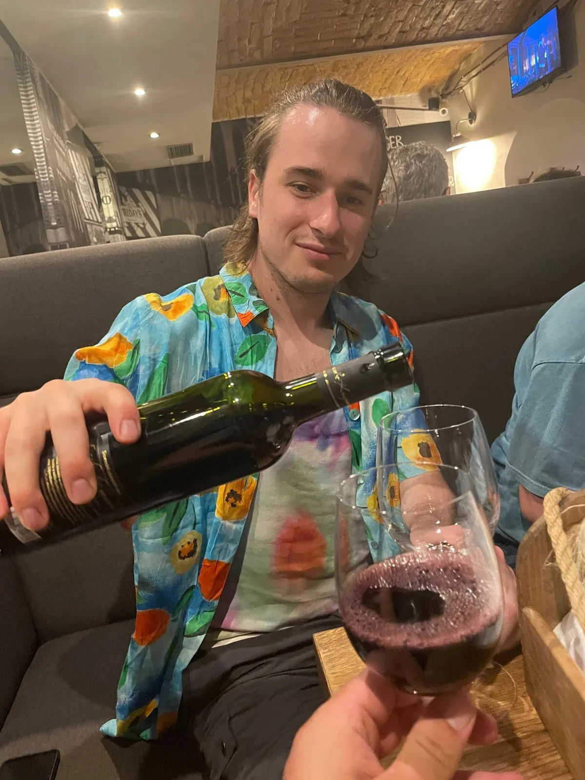 Tom drinking wine